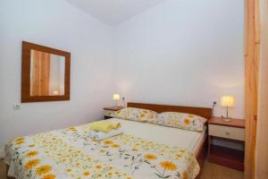 Postel nebo postele na pokoji v ubytování Apartments Mari