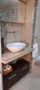a bathroom with a white sink and a shower at Casa Laprida in Mar del Plata +20 photos