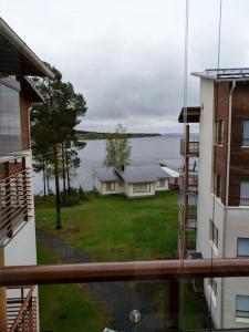 a view from a balcony of a house with a yard at Kaksio Kivitipun lähellä in Lappajärvi