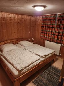 Postel nebo postele na pokoji v ubytování Alpenhaus Flügelbeck - Selbstversorgung