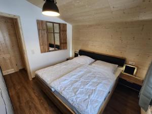 Postel nebo postele na pokoji v ubytování Alpenhaus Flügelbeck - Selbstversorgung