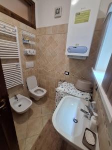 a bathroom with a sink and a toilet at Casa Porta Napoli in Castel di Sangro