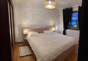 Postel nebo postele na pokoji v ubytování Full Sun Lodge