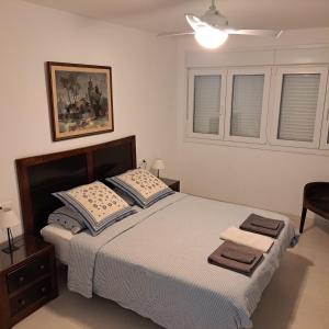 Ένα ή περισσότερα κρεβάτια σε δωμάτιο στο Apartamento frente a la playa Piso 3 +13 φωτογραφίες