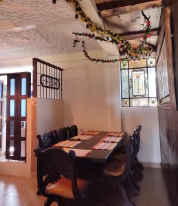 a dining room with a table and some chairs at Casa Guanentina - Habitaciones familiares in Villanueva +24 photos