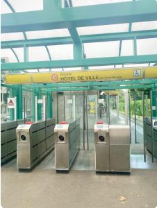 a lobby of a building with a hotel die village sign at Art de recevoir - L'Écrin de Margnolles - Croix Rousse - Métro C-Cuire in Caluire-et-Cuire