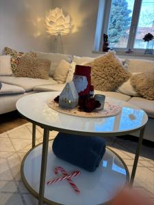 a cake on a table in a living room at Home of gmiatlich - Ferien & Wohnen auf Zeit in Mühldorf +24 photos