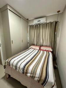 Katil atau katil-katil dalam bilik di Apartamento São Luís Araçagy Lado Praia