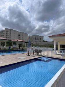 Kolam renang di atau dekat dengan Apartamento São Luís Araçagy Lado Praia