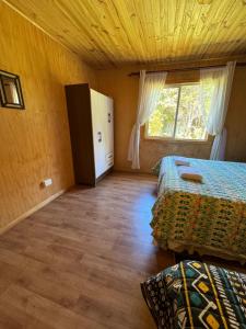Postel nebo postele na pokoji v ubytování "Cabaña A y M"