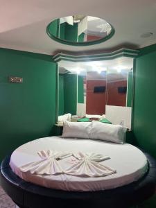 Postel nebo postele na pokoji v ubytování Hotel Paradise