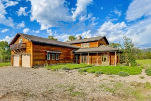 a log home with a gambrel at Spacious Afton Home Patio, Grill and Mountain Views in Afton