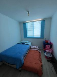 Ένα ή περισσότερα κρεβάτια σε δωμάτιο στο Apartamento