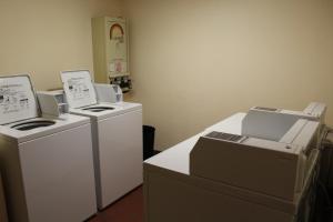 a kitchen with a refrigerator and a microwave at Motel 6-Lewisville, TX - Medical City in Lewisville