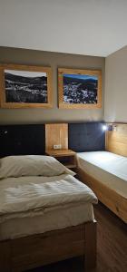 Postel nebo postele na pokoji v ubytování Apartmány Špacír 3