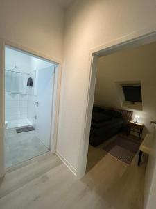 a bathroom with a shower and a sliding glass door at Auszeit Offenburg in Offenburg
