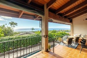 a balcony with a view of the ocean at Hawaiian Escape with Pool Expansive Lanai Stunning Sunset Views in Kailua-Kona