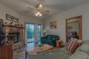 a living room with a couch and a fireplace at 2BR Village At Indian Point 901 near SDC-Free Tickets Daily up to $500 Value in Branson