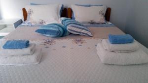 A bed or beds in a room at Medieval Rose Guest House