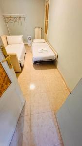 a hospital room with two beds and a door at apt via cernaia rome center in Rome