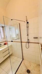 a shower with a glass door in a bathroom at apt via cernaia rome center in Rome
