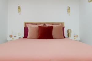 Postel nebo postele na pokoji v ubytování Suite romantique avec jacuzzi