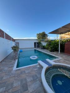 a swimming pool in the middle of a yard at Hotel Casa Cuenca in Garzón