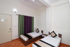 Postel nebo postele na pokoji v ubytování Hotel O Prime Plaza + 20 fotografií