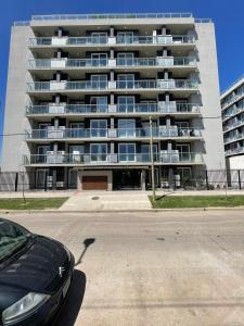 a car parked in front of a large building at Roma in Belén de Escobar