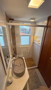 a bathroom with a toilet sitting on a counter at Triplex Luxo 2 Qtos c Churrasqueira na Rua das Pedras in Búzios