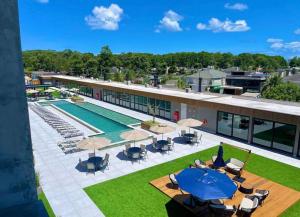 an aerial view of the pool at a resort at Charmoso Loft em Resort in Xangri-lá