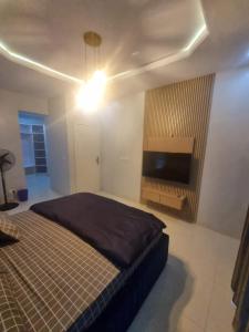 Postel nebo postele na pokoji v ubytování Stren Mulberry Apartments + 9 fotografií