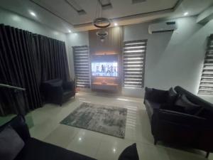 TV a/nebo společenská místnost v ubytování Stren Mulberry Apartments