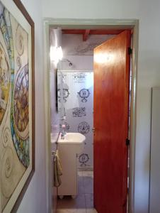 a bathroom with a sink and a mirror at Agua de Oro antistress cabana in Agua de Oro