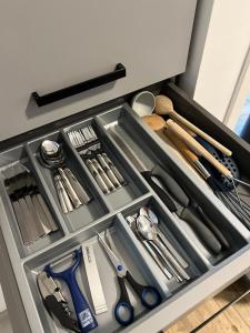 a drawer filled with scissors and other kitchen utensils at NEUES appartment LOVE&LIGHT in Ollersdorf im Burgenland
