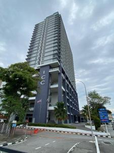 a tall building with a sign on the side of it at ICC Suites Ipoh City Centre in Ipoh