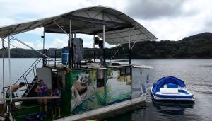 a dog painted on the back of a boat in the water at El Ismael de Jaguas in San Rafael