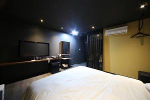 Postel nebo postele na pokoji v ubytování Soho Hotel