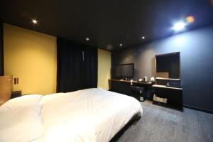 Postel nebo postele na pokoji v ubytování Soho Hotel