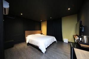 Postel nebo postele na pokoji v ubytování Soho Hotel