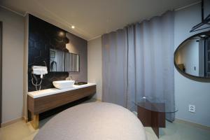 Postel nebo postele na pokoji v ubytování Soho Hotel