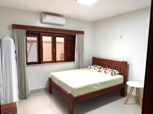 Giường trong phòng chung tại Beach House