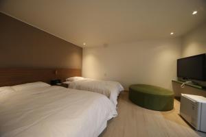Postel nebo postele na pokoji v ubytování Soho Hotel