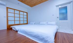 Letto o letti in una camera di 妃民宿 l 宜蘭包棟民宿 依人數開房