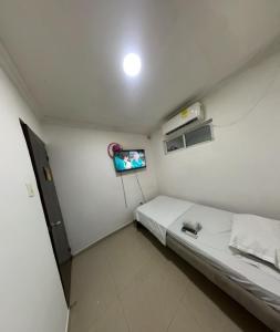 Postel nebo postele na pokoji v ubytování Hostal Viva Mar