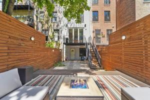 a courtyard with a fire pit in the middle of a building at SWJ544FH Huge 6BR 4BA Backyard Access in New York