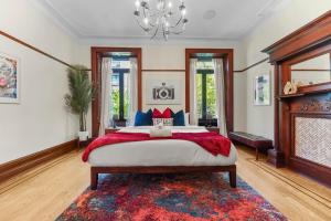a bedroom with a large bed and a fireplace at SWJ544FH Huge 6BR 4BA Backyard Access in New York