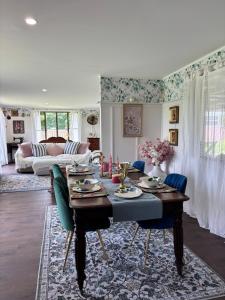a living room with a table and a couch at Lenlie Farm in Howard