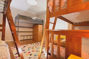a bedroom with two bunk beds and a bunk bed at Two Pines, whole home in Tullamarine near airport! in Melbourne