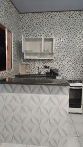 Kuchyň nebo kuchyňský kout v ubytování Chalé toque toque pequeno